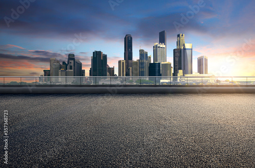 Empty floor platform with sunset view modern city skyline background