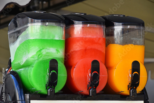 Colorful slush ice smoothies in machine