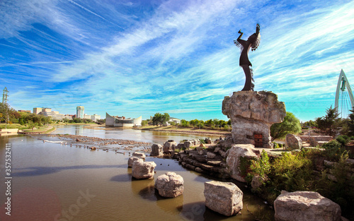 Keeper of the plains Sculpture in dramatic background in Wichita Kansas