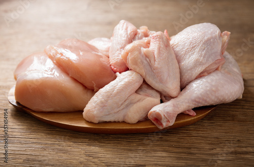fresh chicken meat on a wooden board