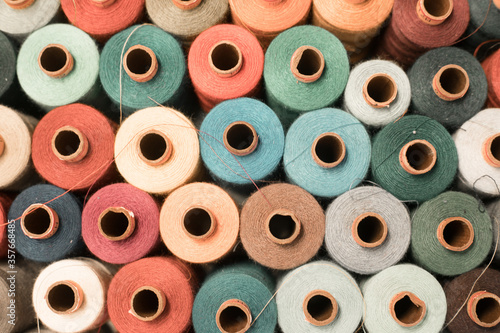 Threads in a tailor textile fabric: colorful cotton threads, birds eye perspective