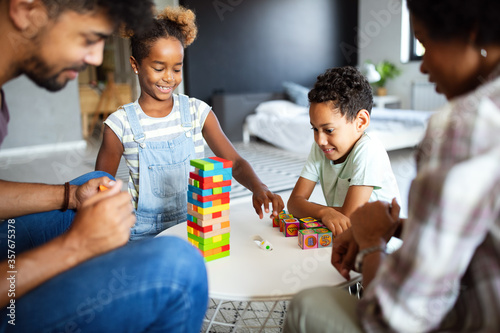 Happy family playing and having fun together at home.