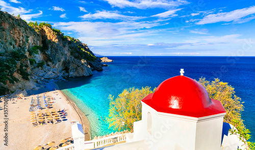 most beautiful beaches of Greece, Karpathos island - Kyra Panagia with turquoise sea and red church.