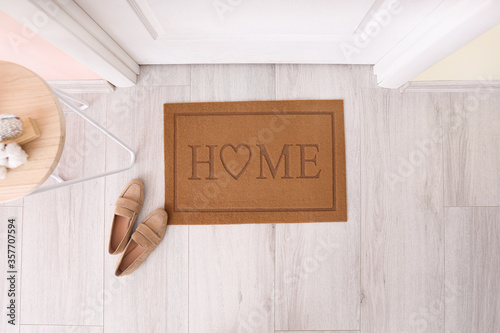 Door mat with shoes in hallway