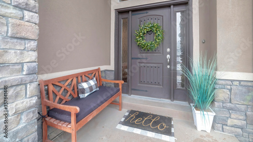 Panorama Gray front door entrance with wreath and sidelights under large transom window