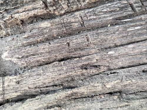 wood surface that is old with brown and black colors
