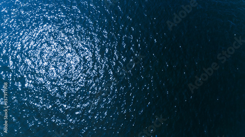 Aerial top view of blue sea surface