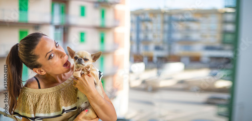 Charming girl in sweet moments with her dog