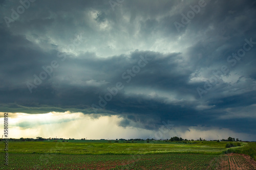Supercell storm clouds with wall cloud and intense rain