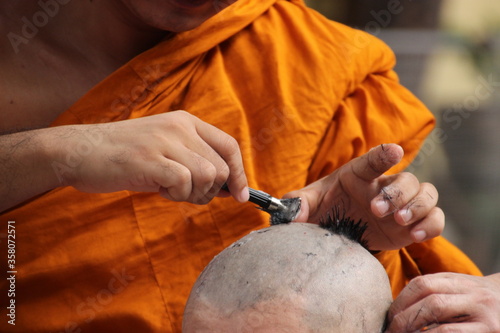 shaving hair in ordination ceremony to be monk tradition 