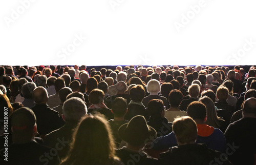 people in the audience during the event and the white screen can