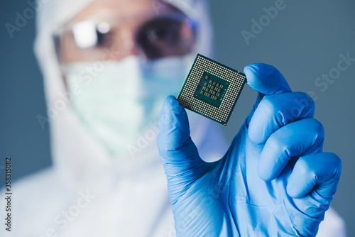 Scientist holding a chipset 