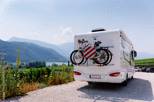 Vacation trip with RV caravan Car with bicycle at Italian South Tirol
