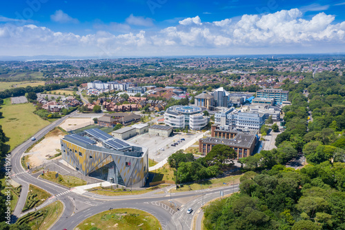 Aerial photo of the Bournemouth University, Talbot Campus buildings from above showing the Arts University Bournemouth, the Student Village, Fusion Building, Medical Centre