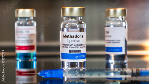 Bottle of methadone injection with a syringe