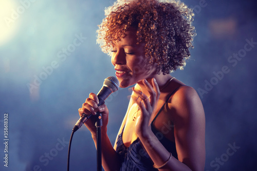 Black female Singer Performing on stage