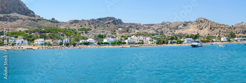 Panoramic view of Stegna beach with apartment houses close to Town of Archangelos (RHODES, GREECE)