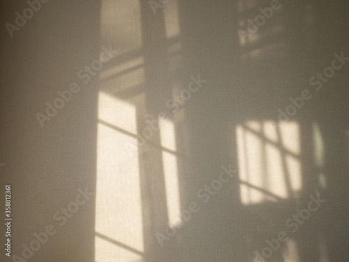 Abstract shadows from window on wall. 