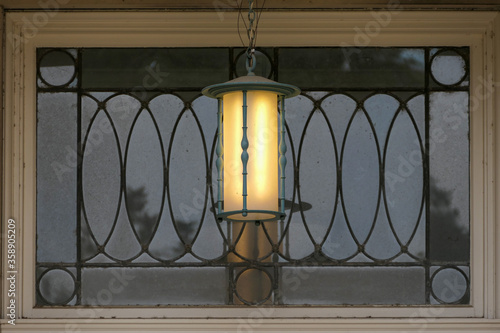 porch light in front of transom window