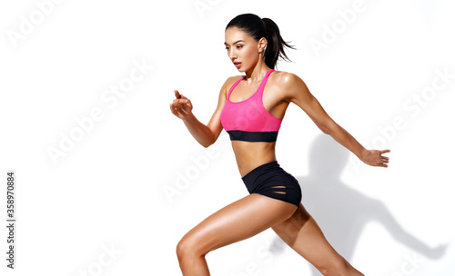 Sporty girl runner in silhouette. Photo of girl with perfect body on white background. Dynamic movement. Side view. Sports and healthy lifestyle