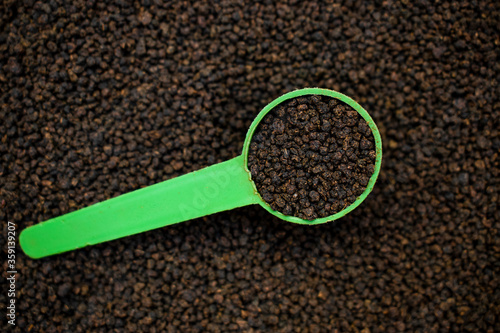 spoon of black tea powder or chai patti