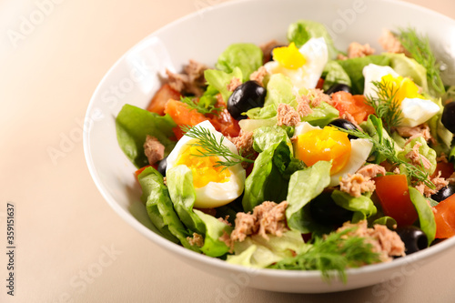 vegetable salad with egg, tomato, tuna, olive