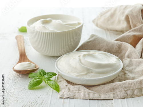 bowls of sour cream or yogurt