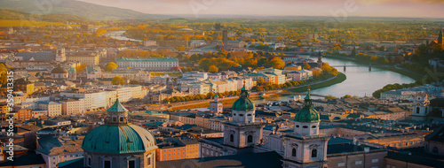 Panoramic view of Salzburg skyline historic city of Salzburg with Salzach river in beautiful golden evening light sky and colorful of autumn at sunset,Salzburger Land, Austria
