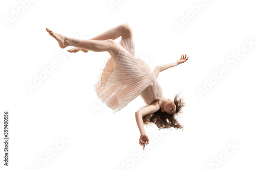 Mid-air beauty cought in moment. Full length shot of attractive young woman hovering in air and keeping eyes closed. Levitating in free falling, lack of gravity. Freedom, emotions, artwork concept.