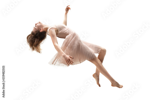 Mid-air beauty cought in moment. Full length shot of attractive young woman hovering in air and keeping eyes closed. Levitating in free falling, lack of gravity. Freedom, emotions, artwork concept.