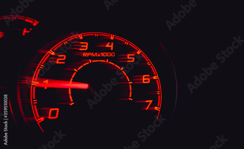 Driver's cockpit ; speedometer on dashboard - colorful light in black, copy space for your abstract design 