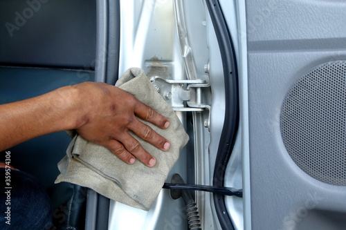 Clean the car door hinges with chamois