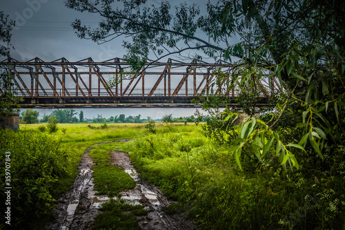 Mud on a dirt road under the bridge.