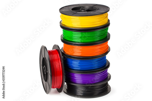 Black, red, blue, green, violet, orange, yellow, white filament 3d printer isolated on white background