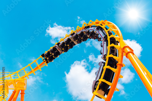 Rollercoaster railroad car no people testing track high to the sky roll bend and twist for exciting fun people at theme park during Coronavirus(Covid-19) pandemic