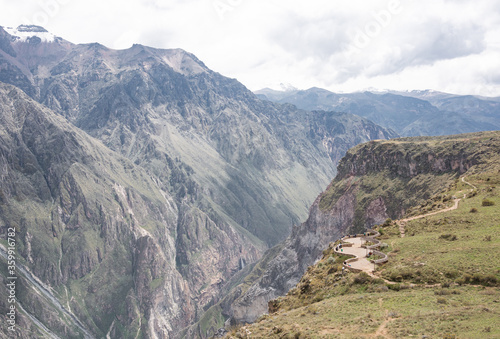 Panoramic view of Colca Canyon with beautiful rocky mountains and Cruz del Condor viewpoint near Arequipa, Peru.