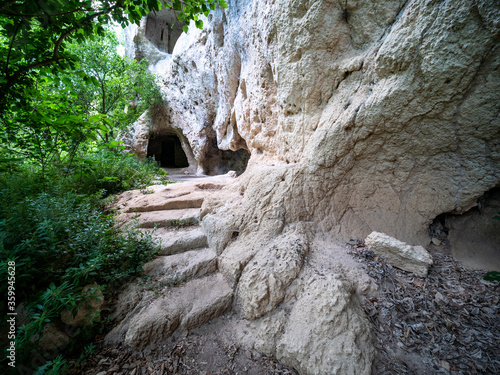 Gravina of Madonna della Scala. The gravina is a typical canyon of Puglia and Basilicata with cave dwellings carved into the rock and rock churches, Massafra, Apulia, Italy