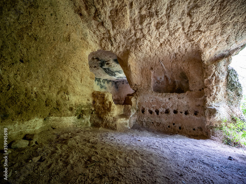 Gravina of Madonna della Scala. The gravina is a typical canyon of Puglia and Basilicata with cave dwellings carved into the rock and rock churches, Massafra, Apulia, Italy