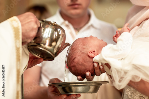 Baptism ceremony in Church. baptism holy water Catholic