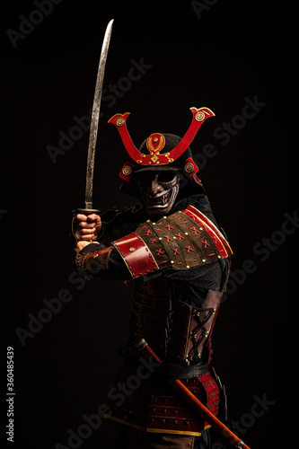 Portrait of a samurai in armor in attack position