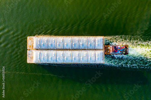 Overhead view of a shipping barge moving through the intercoastal waterway