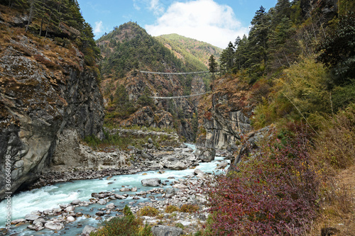 A double suspension bridge over the Dudh Koshi river on the way to Namche Bazar.