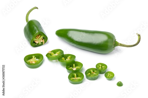 Fresh green jalapeno peppers and slices