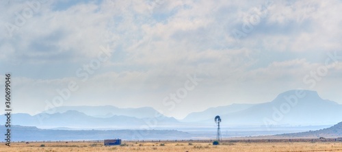 KAROO WINDMILL. the karoo is a semi desert, arid basin. Prone to drought and long dry spells. Eastern cape, South Africa.