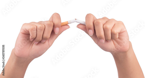 Quit smoking, human hands breaking the cigarette isolated on white background.