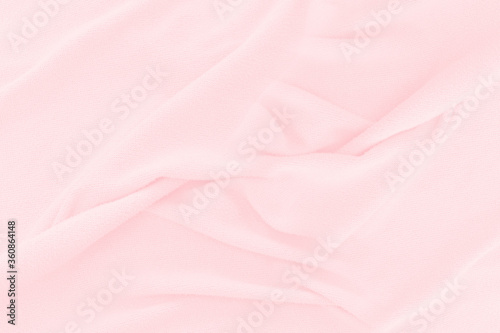 Soft pink fabric texture background. Abstract cloth silk for wallpaper or backdrop