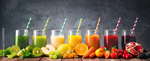 Assortment of fresh fruits and vegetables juices in rainbow colors