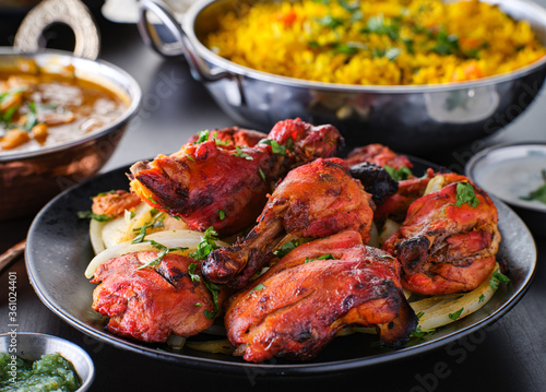 indian tandoori chicken with onions and cilantro