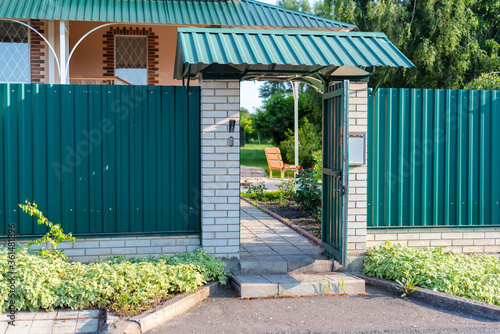 opened wicket gate door to a private house