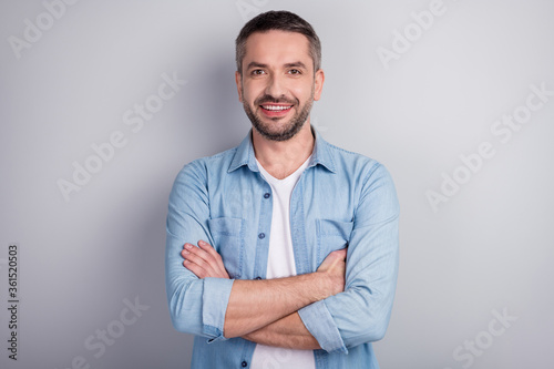 Close-up portrait of his he nice attractive cheerful cheery content successful guy company executive worker manager folded arms isolated over gray light pastel color background